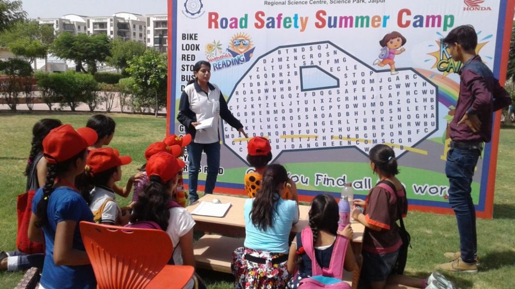 Honda Trainer giving Road Safety Lessons to children at Honda Road Safety Summer Camp - Honda Traffic Training Park - Science Park - Jaipur