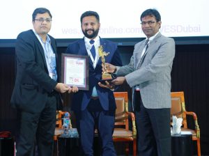 Naveen KM - MD Trio World Academy receiving award for Global Collaborative Learning Environments at World Education Summit Dubai