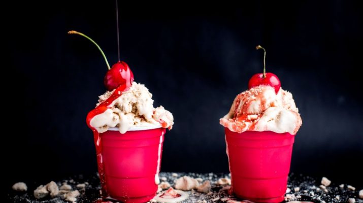 Ice Cream Sundae with crushed coffee meringue and strawberry sauce