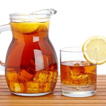 Jug-of-cold-summer-iced-drink-with-lemon-tea-with-slice-lemon-in-pitcher
