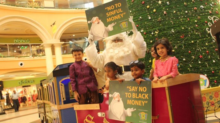 Santa posing with the kids and spreading the message Say YES to white money at Growels 101 Mall - Kandivali east