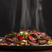Barbeque Nation - steaming chicken sizzler with noodles - Smokin Sizzlerz