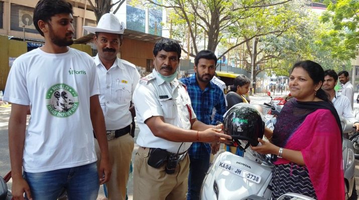 Traffic Police Giving away the helmets - World Head Injury Day