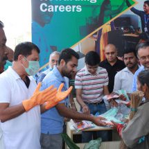 BBMP Workers and particpants collecting masks and gloves during the Clean Bengaluru campaign - Omega Healthcare
