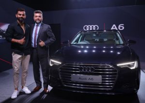 Virat Kohli - captain of Indian cricket team with the new Audi A6 launched in Mumbai